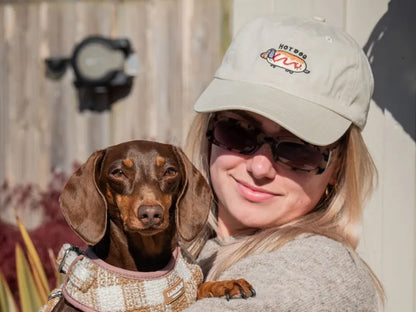Neutral dog parent cap with dachshund embroidery.